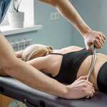 Chiropractor using graston technique